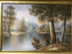 A gilt framed mirror and a gilt framed oil on canvas - river