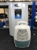 A Delongi air conditioner and a de-humidifier