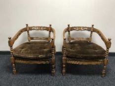 A pair of continental over sized armchairs