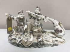 A carved oriental figure -fisherman