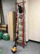 A JCB petrol strimmer and two sets of folding steps