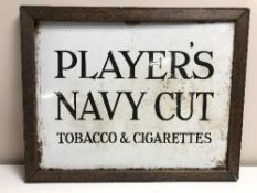 An oak framed Players Navy Cut Tobacco & Cigarette enamel advertisement