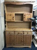 A pine effect kitchen dresser