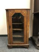 An inlaid mahogany music cabinet
