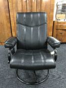 A contemporary black leather armchair