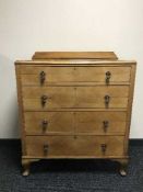 A 1930's walnut four drawer chest