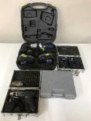 A cased Challenge Extreme 18 volt electric drill and three cased electric screw drivers