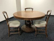 A Victorian mahogany circular pedestal breakfast table on lion paw feet.
