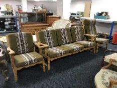 A three piece oak framed lounge suite in green