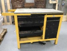 A Wheel-a-bench metal work bench