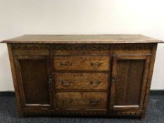 An Edwardian oak sideboard