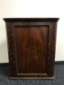 A Victorian mahogany hanging corner cupboard