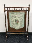 A Victorian mahogany needlework fire screen