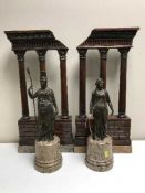 A pair of bronze classical style statues on marble bases and a pair of mahogany ormolu mounted