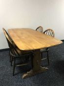 An Ercol refectory table and four chairs