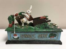A cast iron metal bunnies bank
