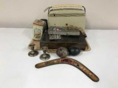 A tray of Bush radio, maracas, boomerang, canteen of cutlery,