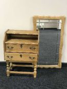 A continental oak two drawer chest and matching wall mirror