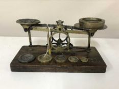 A set of early 20th century postal scales with weights