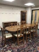 A Chapmans Regency style yewwood dining room suite comprising of extending dining table, with leaf,