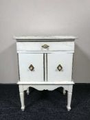 A painted pine tiled topped cabinet