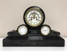 A Victorian black slate mantel clock with enamelled dial thermometer & barometer apertures