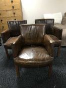 Three brown button leather armchairs