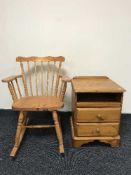 A pine rocking chair and bedside cabinet