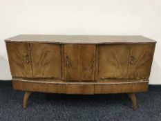 A mid 20th century cocktail cabinet and drop leaf table