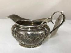 A sterling silver milk jug