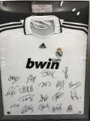 A framed Real Madrid signed football shirt with Bwin.