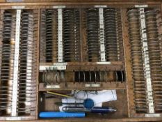 Four early 20th century boxes containing optometrists lenses