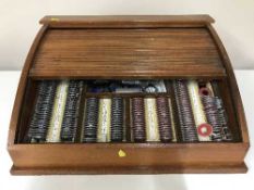 A counter top shutter door cabinet containing optometrists lenses