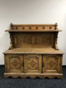 A late Victorian carved oak buffet sideboard