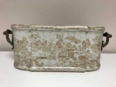 A Victorian style ceramic planter with gilt metal handles