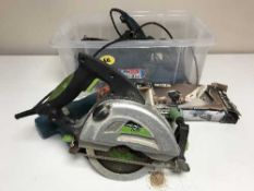 A box of assorted power tools inc.