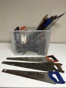 Two boxes of sockets, light fittings, toilet seat and a large quantity of hand saws,