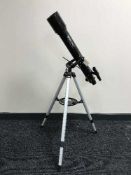 A Celestron Power Seeker 70AZ telescope on stand