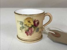 A miniature Royal Worcester hand painted blush ivory mug