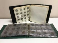 Two coin albums containing coins of the world