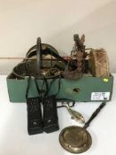 A box and basket of copper horn, jam pans, oil lamps,