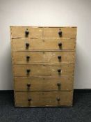 A Victorian pine seven drawer wardrobe centre piece