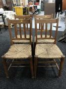 A set of four antique chapel chairs