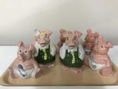 A tray of three Nat West pigs and four others