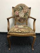 An antique shield back armchair