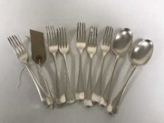 A set of seven silver forks,