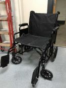 A folding lightweight wheel chair