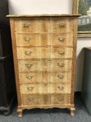 A light oak seven drawer chest