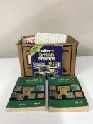 A box of loose stamps and stamp reference books