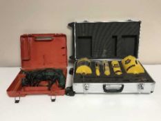A cased Bosch corded hammer drill,